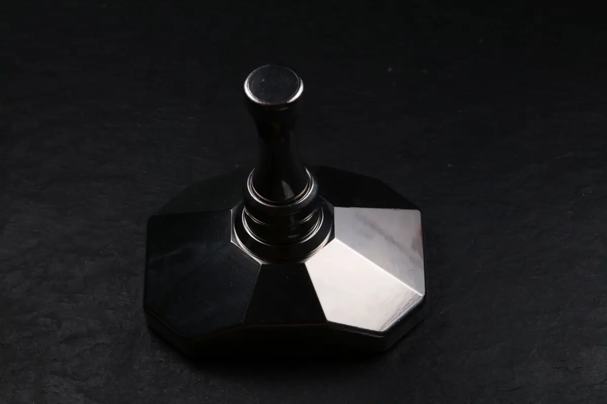 The assembled crusher at three quarters on dark slate